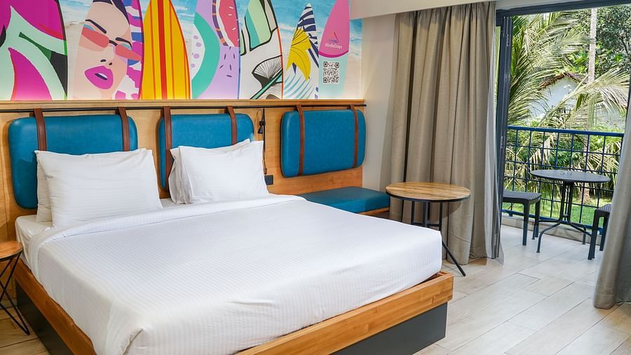 A large bed in Cozy Double Room at Indie Stays Resort, Goa.